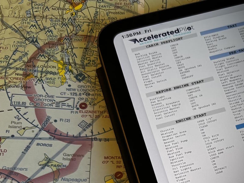 The Accelerated Pilot custom aircraft checklist displayed on an iPad over a sectional chart